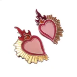 Pendientes con diseño de corazón sagrado en colores rojo y dorado, con detalles llamativos.