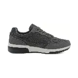 Zapatillas deportivas urbanas negras con detalles en gris y marrón. Presentan cordones y suela de goma blanca y negra.