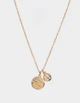 Cadena dorada con dije redondo con el signo zodiacal Géminis y pequeños strass, y dije pequeño con el número romano II.