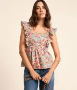 Blusa sin mangas de viscolino con estampado floral liberty, escote cuadrado delantero y trasero, volados en las sisas y lastex en la espalda.