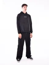 Buzo hoodie negro con bolsillo canguro y cordones ajustables. Estampado con la frase "YOU DON'T HAVE TO BE PERFECT TO START" en el pecho.