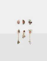 Set de tres pares de aros pasantes dorados con forma de frutas con strass de colores.