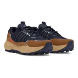 Championes de trekking Under Armour modelo Fat Tire Venture Pro, color marrón con detalles en beige. Inspirados en bicicletas Fat Tire, con suela de goma resistente y amortiguación UA HOVR.