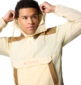 Campera tipo anorak Columbia Challenger, color amarillo y marrón, con capucha ajustable, media cremallera frontal, puños elásticos, dobladillo ajustable, bolsillo canguro y tecnología Omni-Shield™ repelente al agua y las manchas.