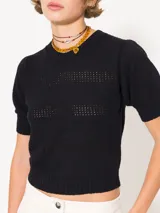 Sweater celeste tejido en bucle, de mangas cortas y largo a la primer cadera.