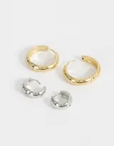 Set de dos pares de aros argollas de acero quirúrgico, un par dorado pequeño y un par plateado mediano.