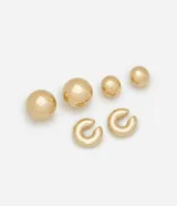 Kit de tres aros dorados: un aro orgánico, un aro bold y un piercing bold.