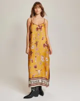 Vestido camisero largo con estampado de motivos del oeste, escote en V y tirantes finos. Aberturas laterales y corte holgado.
