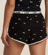 Short de pijama negro con estampado de perritos blancos y cintura elástica con la inscripción "LOV".