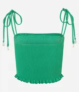 Blusa cropped color blanco, con textura de lastex, breteles finos con lazo y escote recto.