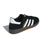 Championes Adidas Handball Spezial negros con detalles en blanco y suela de goma marrón.