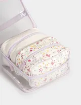Neceser transparente con estampado floral, con manija superior y doble cierre.