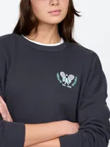 Buzo deportivo azul con cuello redondo, puños y ruedo acanalados. Estampado frontal con el logo de Gap Athletic en color celeste.