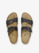 Sandalias Birkenstock modelo Sydney, color negro brillante, con dos correas ajustables con hebillas metálicas.