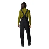 Pantalón tipo jardinero negro de softshell con tirantes ajustables, cierre frontal con cremallera, bolsillos laterales con cremallera y bolsillo en el pecho.
