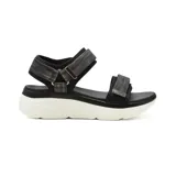 Sandalias bajas color beige con plataforma blanca y tiras con ajuste de velcro.