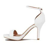 Sandalia de tacón alto Vizzano, color blanco, con una tira delgada sobre los dedos y pulsera al tobillo con hebilla dorada.