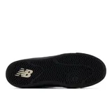 Zapatillas urbanas New Balance modelo 417, color beige con detalles en negro y blanco.