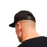 Gorra Puma unisex azul marino con visera gris y logo Puma bordado en blanco.