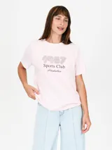 Remera color salmón con estampado de flor blanca y texto "Venice California".