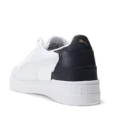 Championes urbanos Puma Shuffle Downtown, color blanco con detalles en negro y dorado, con logo Puma en el lateral y talón en contraste.