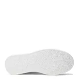 Championes urbanos color beige con suela marrón de plataforma.