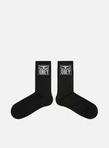 Medias negras de caña media con logo Obey Eyes Icon en blanco en la parte superior.