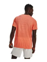 Remera deportiva gris jaspeado de corte clásico, con cuello redondo y mangas cortas. Confeccionada con tejido de punto transpirable y tecnología seamless para mayor comodidad.