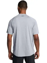 Remera deportiva Under Armour Tech 2.0 de hombre, color gris jaspeado con logo negro en el pecho.