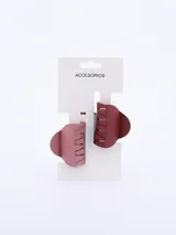 Set de dos pinzas para el pelo con forma de mandíbula, una color rosa claro y otra color borgoña. Diseño con textura acanalada.