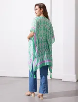 Kimono tejido color naranja con estampado abstracto en blanco y celeste, con terminación de ruedo con borlas.