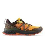 Zapatillas de trail running color amarillo y negro, con suela Vibram® Megagrip y tecnología Fresh Foam X para amortiguación y confort en terrenos irregulares.