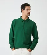 Buzo verde de algodón para hombre, modelo comfort con cuello polo con cremallera, mangas largas, bolsillo frontal y puños ajustados.