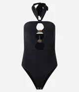 Body negro de microfibra con escote halter, lazo en el cuello, recortes circulares con adornos metálicos y cierre con broches en la entrepierna.