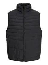 Chaleco acolchado negro sin mangas con cuello alto y cierre lateral oculto y cremallera frontal. Bolsillos frontales y diseño plegable para fácil almacenamiento. Relleno de fibra sintética para calidez ligera.
