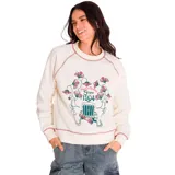 Buzo color crema de corte clásico, con cuello redondo y mangas largas raglán. Presenta un estampado central con flores y texto en tonos rosa y verde. Tiene costuras en contraste color rosa en cuello, puños y ruedo.