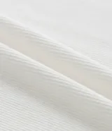 Musculosa plus size color tostado, confeccionada en malla rib de viscosa, con cuello redondo y textura acanalada.