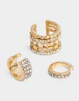 Set de tres aros cuff dorados para la oreja, con apliques de strass y perlas.