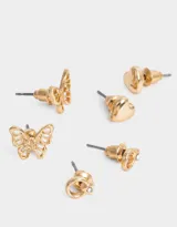 Set de tres pares de aros dorados con pasantes de corazón, mariposa de metal y strass.