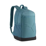 Mochila Puma modelo Buzz, color verde azulado (teal) con base negra. Presenta el logo de Puma en relieve en el panel frontal, un bolsillo superior con cierre y bolsillos laterales de malla.