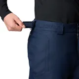 Pantalón de esquí azul marino con costuras selladas, tecnología Omni-Tech™ impermeable y transpirable, forro termorreflectante Omni-Heat™, cintura ajustable, bolsillos con cremallera, polaina interna y refuerzo a presión en la parte inferior de la pierna.