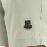 Short de baño liso color celeste, con cintura elastizada y cordón ajustable.