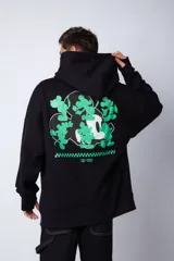 Buzo canguro negro de algodón friza, corte oversize y estampa de Mickey Mouse con detalles en verde.