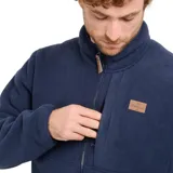 Canguro azul marino de micropolar con cierre frontal, cuello alto, bolsillo vertical en el pecho con cierre y logo de la marca en etiqueta de cuero sintético.