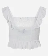 Blusa blanca con escote cuadrado, confeccionada en viscosa con hilo metalizado y lastex. Presenta volados en los breteles y en el bajo.