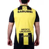 Camiseta de fútbol Puma del Club Atlético Peñarol, modelo Home. Diseño a rayas verticales amarillas y negras con detalles en negro en cuello y mangas. Incluye logo de Puma, escudo del club y sponsor Antel en el frente.