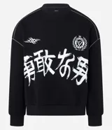 Saco de algodón con felpa color negro, con estampado de lettering japonés en blanco en el frente y bordado del logo "Sport Society" en el pecho. Presenta costuras decorativas en contraste y puños y cintura ajustados.