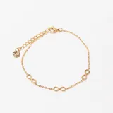 Pulsera dorada de cadena fina con tres dijes de infinito.