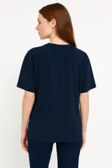 Remera blanca de algodón con estampado de limones, una taza y la frase "Lemon Tarte" en color rosa.