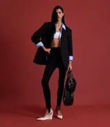 Pantalón legging negro de rib con cintura elástica y piecito.